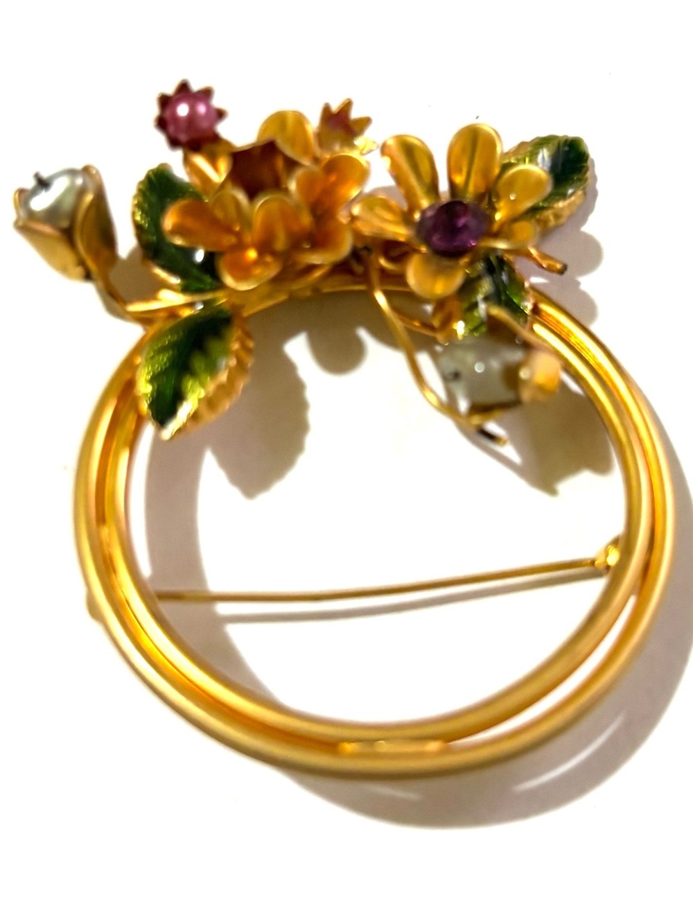 Vintage Gold Floral Brooch with Green Enamel Leaves and Purple Stones